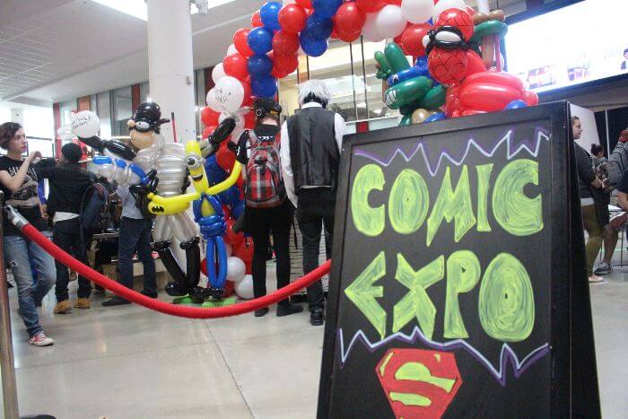 IGNITE Comic Expo 2015 poster with students in line at the event in background