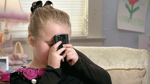 Honey Boo Boo holding her phone to her face