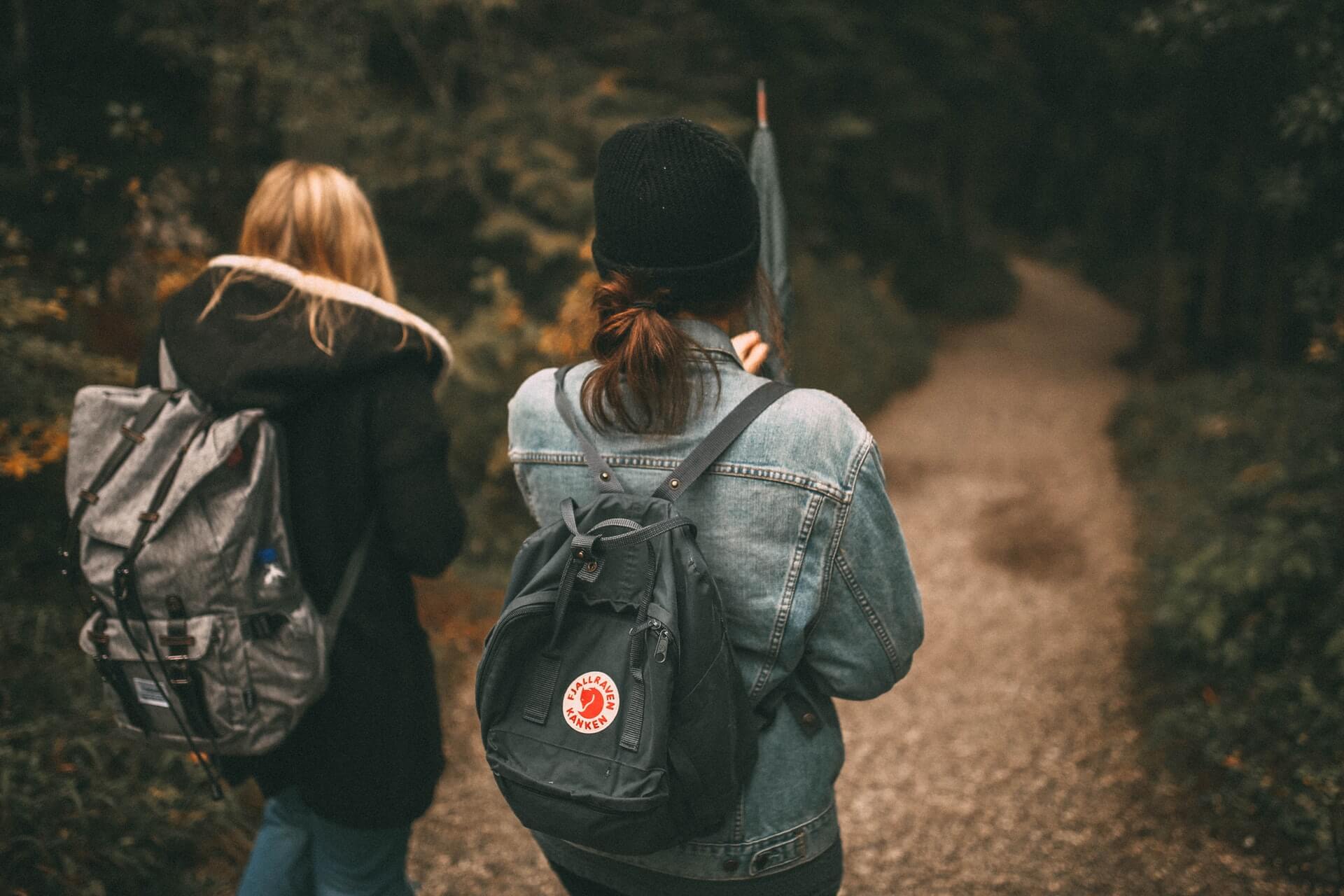 Two girls walking on a trail