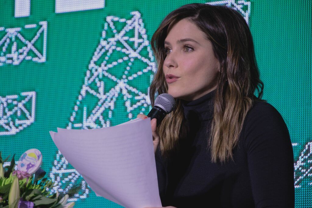 Close up of Sophia Bush's face speaking in a microphone