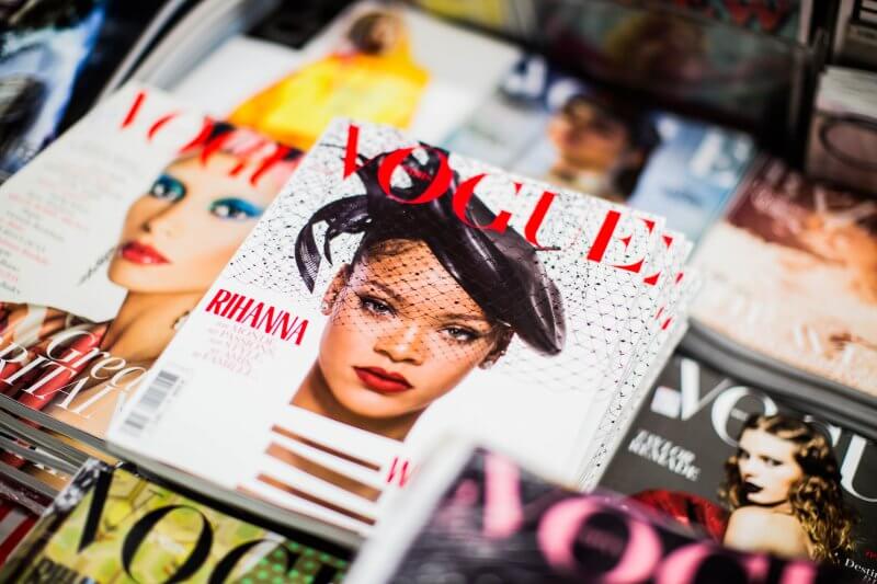 A variety of Vogue magazine covers with Rihanna's cover in center