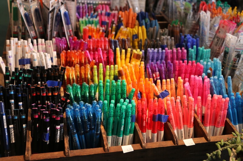 a variety of assorted coloured pens on sale at shop