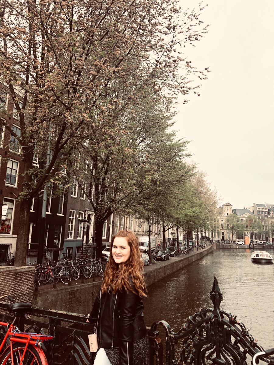 Maegan posing in front of a canal 