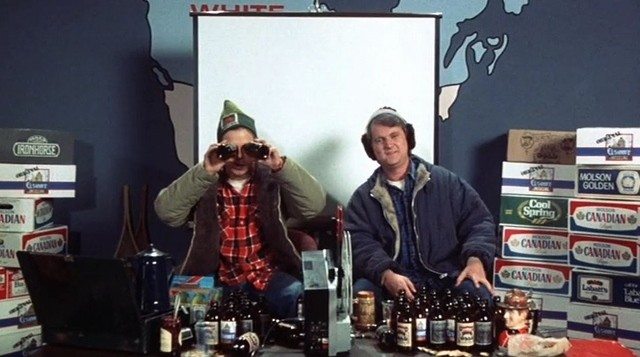 Doug and Bob McKenzie sitting on couch during Strange Brew