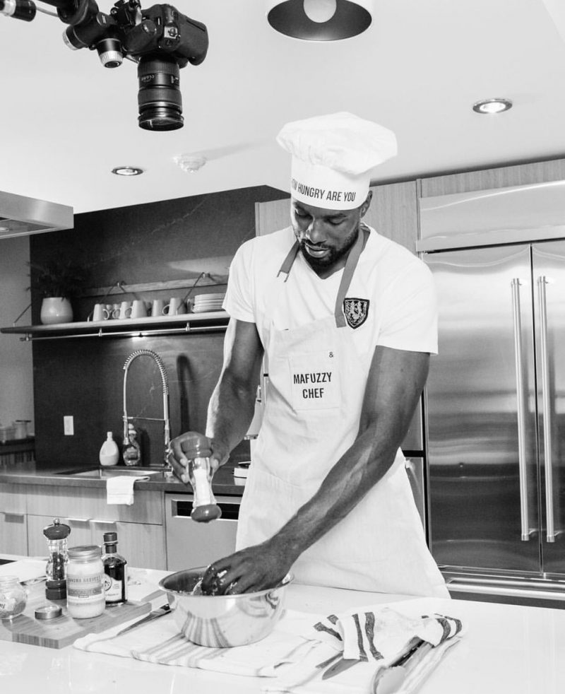 NBA player, serge ibaka wearing chef outfit and cooking