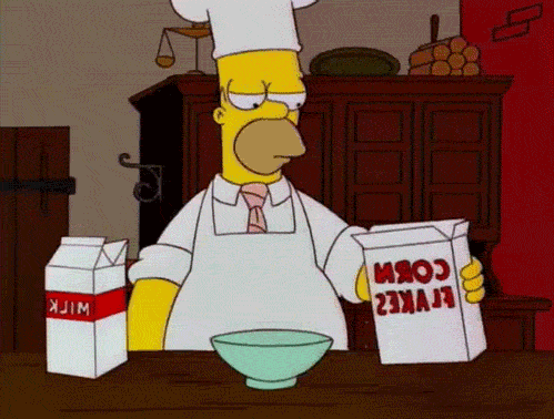 Homer Simpson from The SImpsons pours a bowl of cereal that bursts into flames