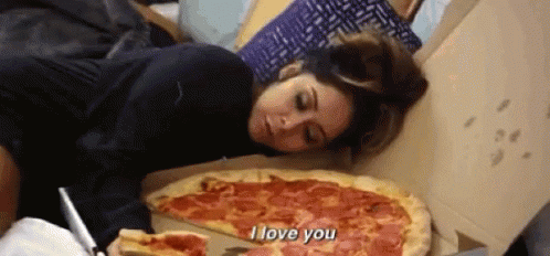 Snooki from Jersey Shore lays next to a box of pizza and says "I love you"