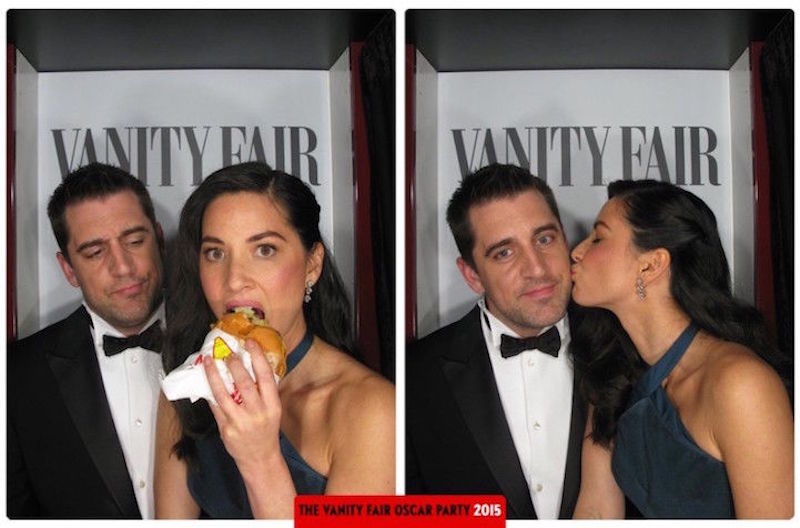 Vanity Fair photobooth with Aaron Rodgers and Olivia Munn eating burger