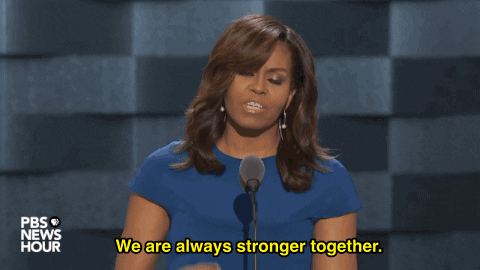 Michelle Obama says, "We are always stronger together," into a microphone.