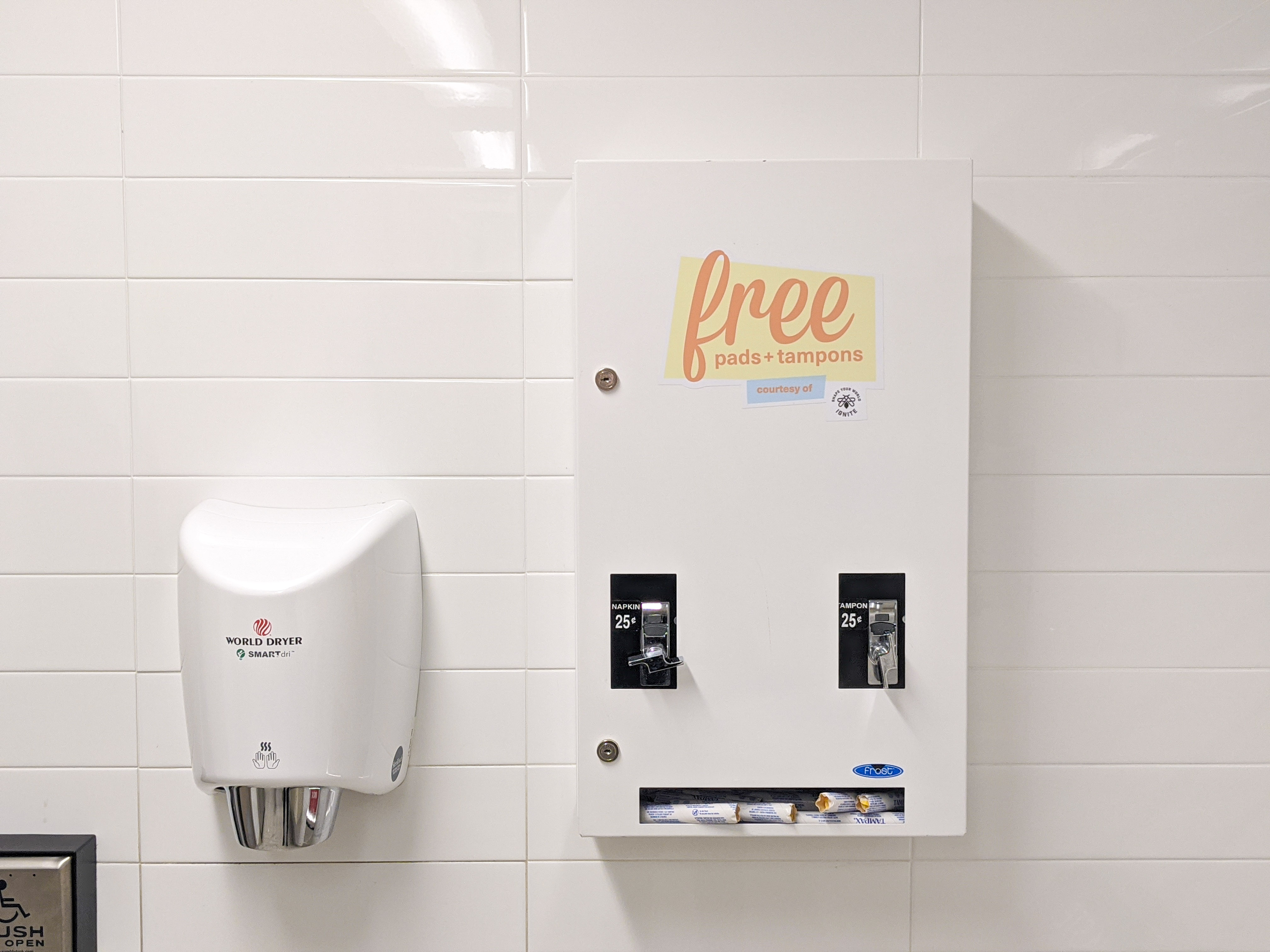 a tampon dispenser with IGNITE branding