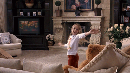 Little girl from Mean Girls dancing in front of tv