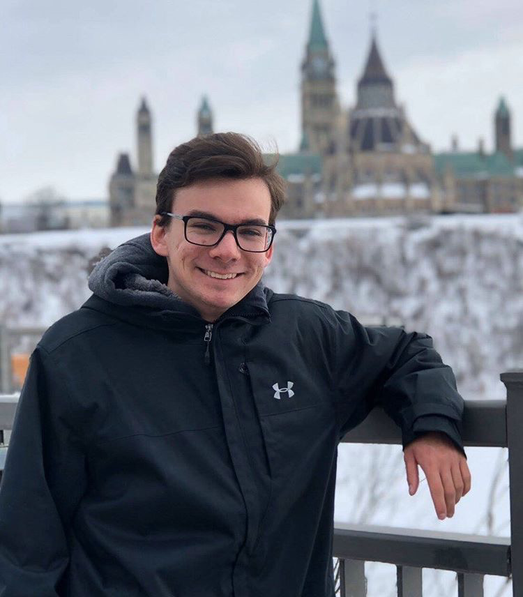 Fourth year University of Guelph-Humber media studies (journalism) student Addison Cheverie stands outside smiling in the winter.