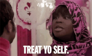 Retta as Donna Meagle in "Parks and Recreation" wears a bright pink and black headscarf and says, "Treat yo' self."