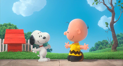 Charlie Brown and Snoopy share a friendly hug.