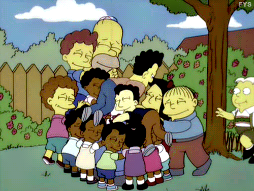 A group of children from The Simpsons pile together in a huge group hug.
