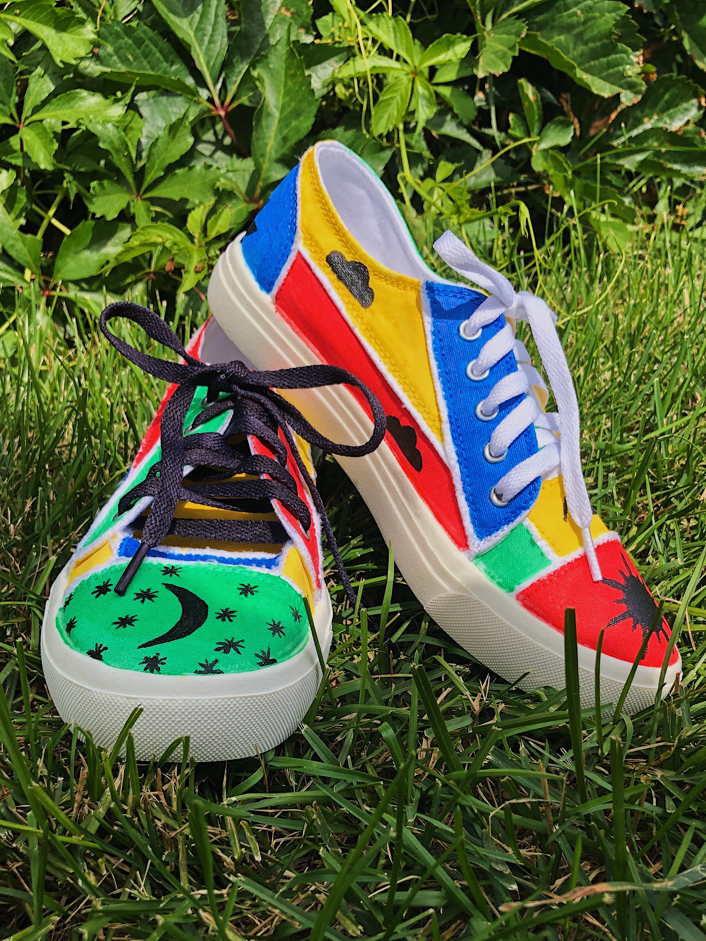 A pair of rainbow painted shoes.
