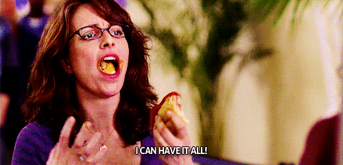 Actress Tina Fey has a mouth full of bread as she exclaims, "I can have it all!"