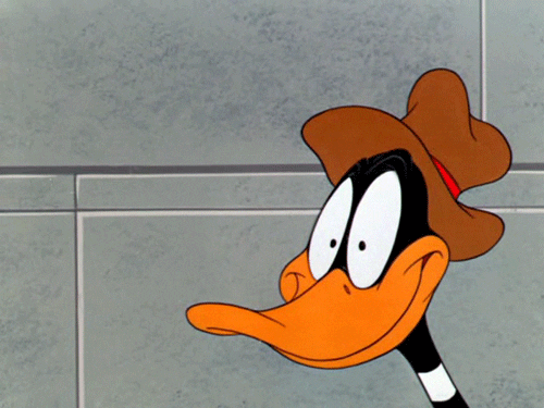 Daffy Duck's eyes enlarge as his pupils turn into dollar signs.