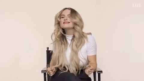 JoJo smiles and dances during an interview with Elle.