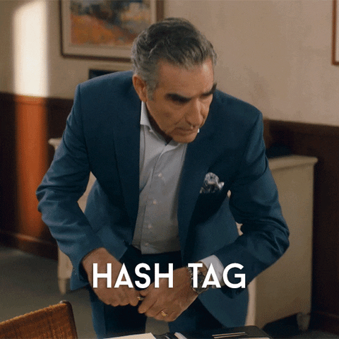 Johnny Rose says, "Hashtag. Is that two words?"