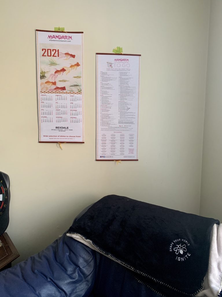 two calendars hanging on a wall