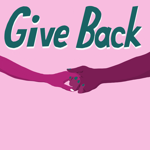Two people hold hands in front of the phrase "Give back to move us all forward."