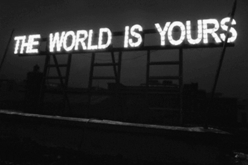 A sign lights up to say, "The world is yours."