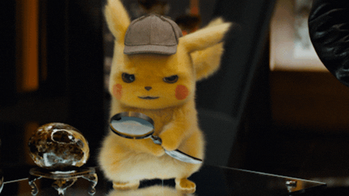 Pikachu uses a magnifying glass.