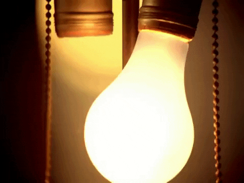 A light bulb turns on and off.