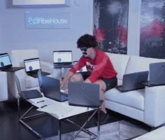 Man working on multiple laptops.