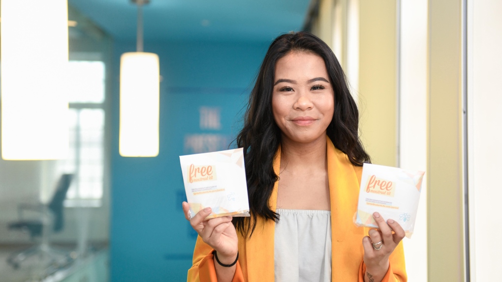 Former IGNITE Lakeshore VP Allisa Lim holding IGNITE’s free menstrual kits