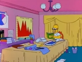 Homer Simpson reading a "Advanced Marketing" book.
