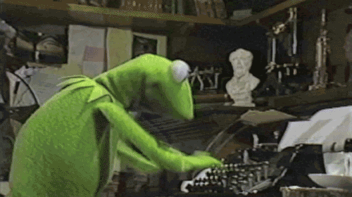 Kermit from The Muppets rapidly using a typewriter.