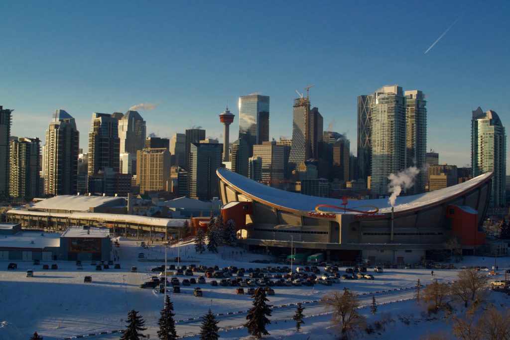 Calgary skyline, featuring the Calgary Tower and Saddledome in the wintertime.