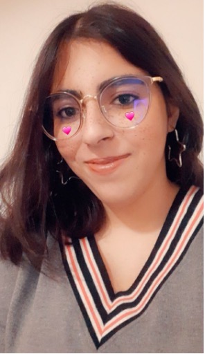 Board of Director Neha Singh smiling with a snapchat filter of hearts under her eyes.