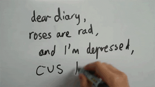 A person writes on a white board.
Text: 
Dear diary,
Roses are red,
and I'm depressed,
Cus I'm fat.
