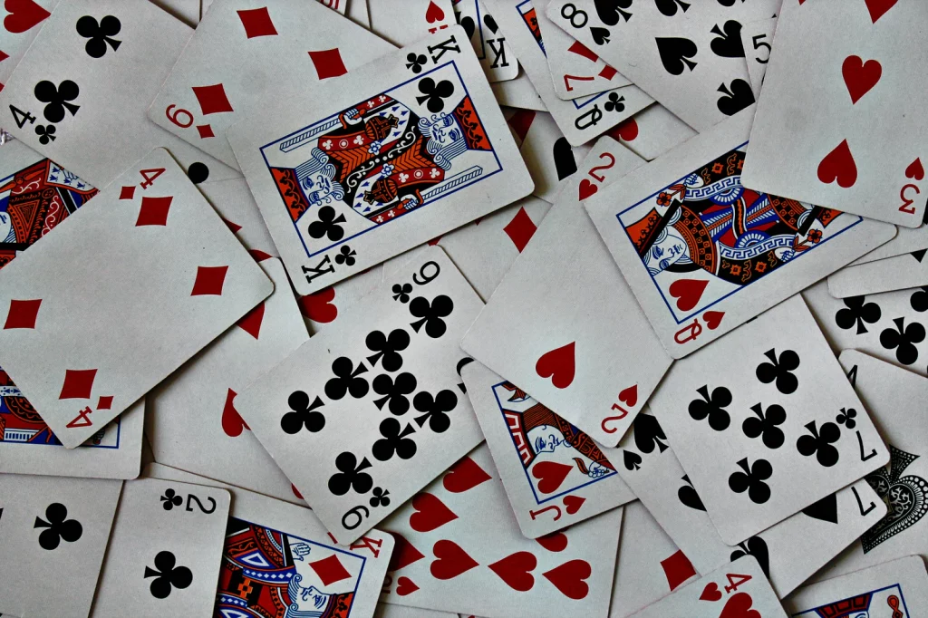 Pile of red and black playing cards.