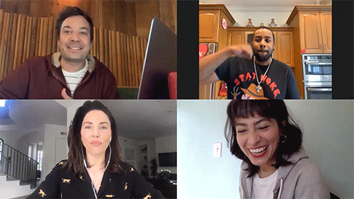 Four people dancing on a video call. 