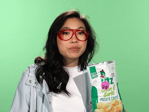 A girl eating healthy veggie chips.

Hungry Snacks Gif