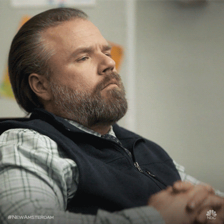 A man dressed in a long sleeve shirt and vest is thinking about something.

Think New Amsterdam GIF