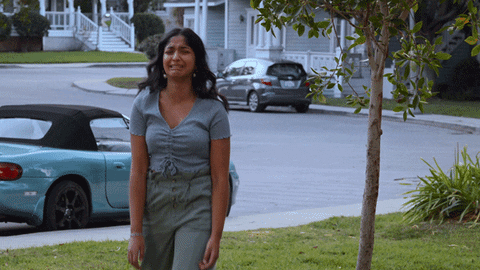 Devi from Never Have I Ever, is dressed wearing a gray blouse and green pants crying. 

Sad Comedy GIF