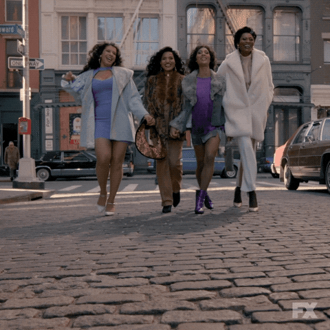 Four friends dressed in coats are walking and holding hands.

Happy Galentines Day GIF