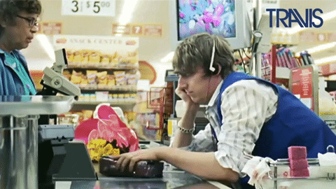 A frustrated cashier is scanning the items and throwing them away.

Bored Grocery Store GIF