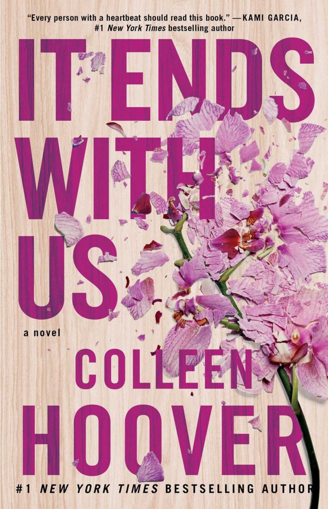 The book cover for the novel "It Ends with us" has a flower with its petals in pieces.