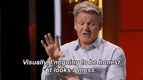 Gordon Ramsey is dressed in a white shirt. He is telling someone that "visually, I'm going to be honest, it looks a mess."
