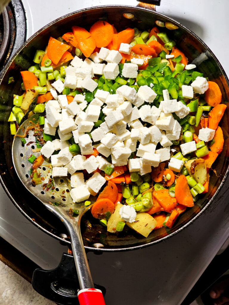 paneer added to a pan
