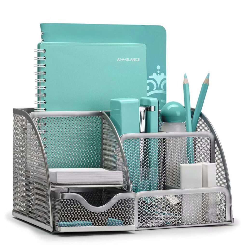 A desk organizer is filled with school supplies such as sticky motes and planners.