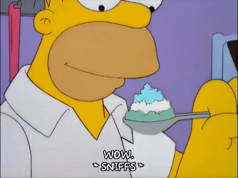 Homer from "The Simpsons" is saying "wow" while sniffing ice-cream.

