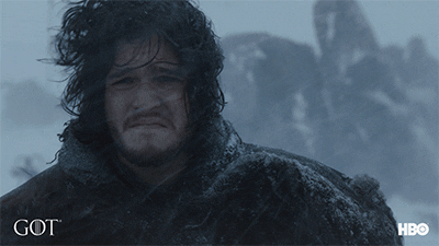 Jon Snow in HBO's Game of Thrones looks unhappy during cold gusts of wind during winter.