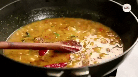 A pot of lentil soup simmering.